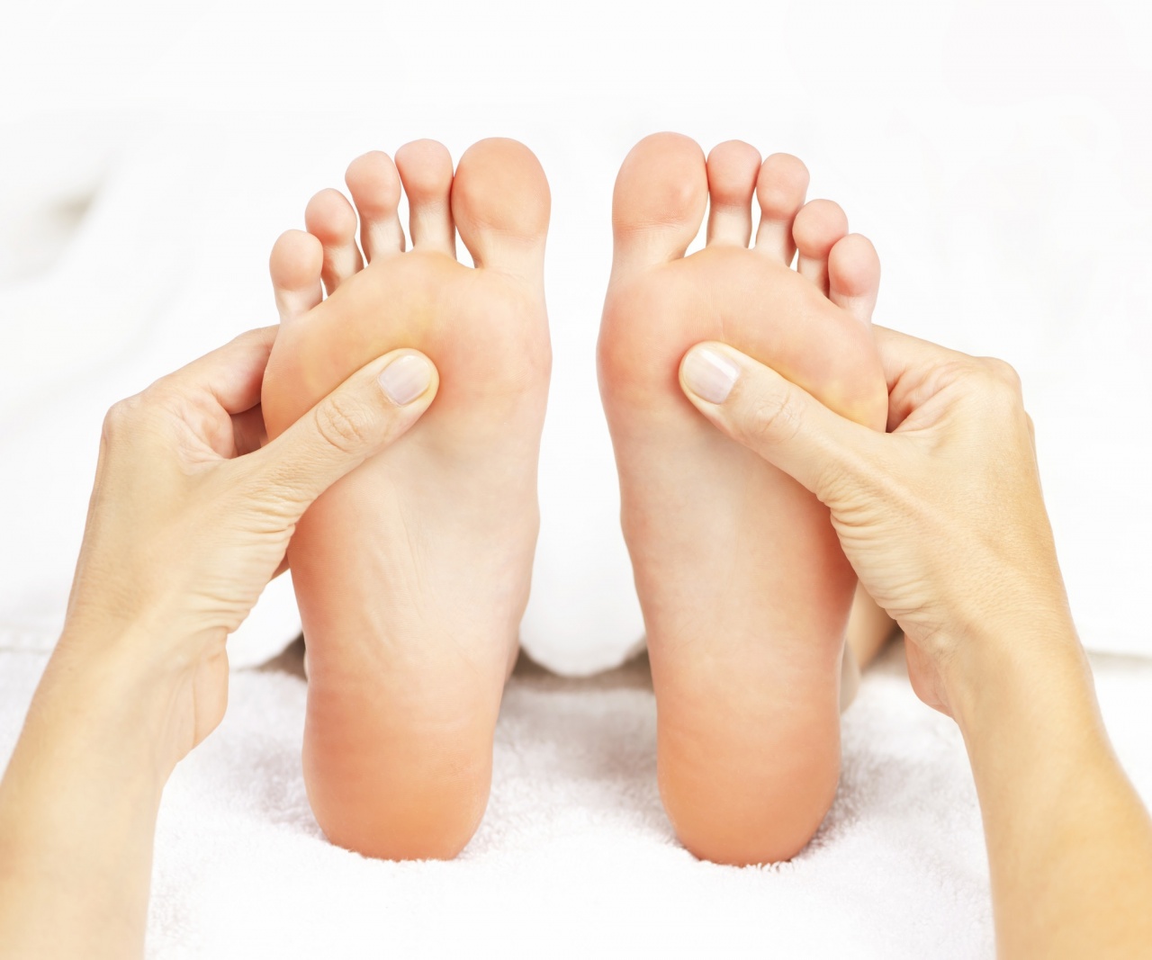 Reflexology massage on the feet